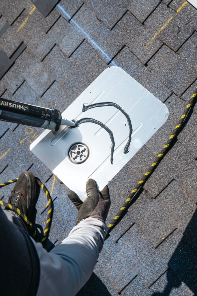 Applying sealant on roofing material